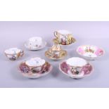 A Meissen cabinet cup and saucer, decorated floral sprays, a Meissen cabinet cup, cover and