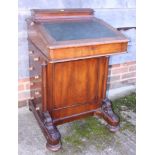 A late 19th century walnut Davenport with maple lined interior and four drawers, 21" wide