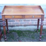 An Edwardian mahogany tray top washstand, fitted two shallow drawers, on turned and tapering