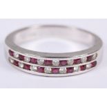 A ruby and diamond ring, in white metal mount, stamped 18ct rind size O