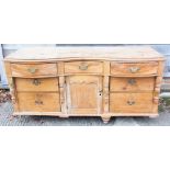 A 19th century pine shape top sideboard / dresser base, fitted drawers over cupboards, 70" wide