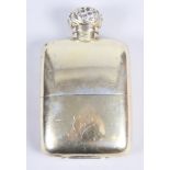 An Asprey silver gilt hip flask with embossed cap, 4.7oz troy approx