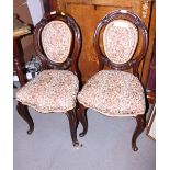 a pair of Maples Carved walnut loop back side chairs with stuffed over seats on cabriole supports