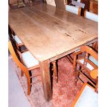 A mid 19th century oak plank top dining table, on chamfered supports, top 68" x 39 1/2"