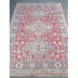 A Wilton bordered rug with three central