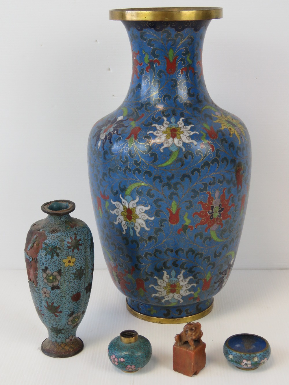 A cloisonné ovoid vase with flower heads