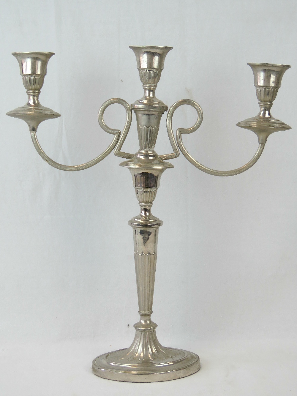 A good three sconce silver plated candel