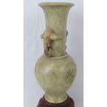 A heavy soapstone baluster vase with ele