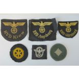 Three WWII German Naval patches, a shooters award patch, a police patch and a drivers award patch.