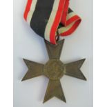 A reproduction WWII German War Merit Cross medal with ribbon.