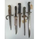 Five bayonets/military fighting knifes including; a French WWI cut down Gras bayonet,