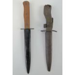 A pair of German WWI fighting knives in scabbards;