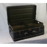 A vintage military travel trunk, lid lifting to reveal compartment with lift out tray,