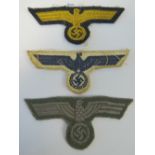 Three German cloth Eagles from the uniform and caps of military officers; one naval,