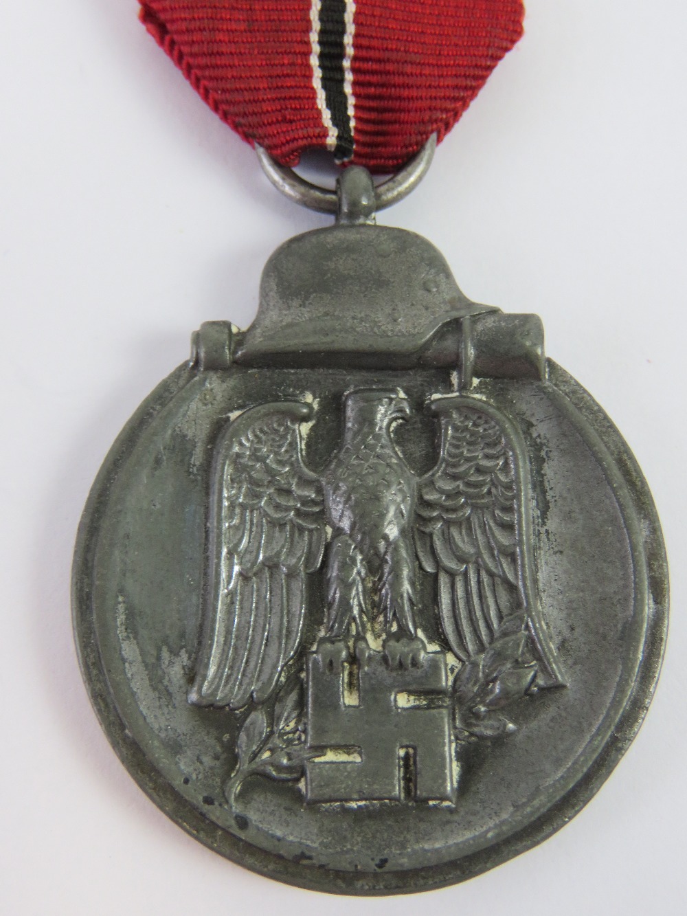 A WWII German Eastern Front 1941/1942 medal with ribbon.