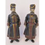 A pair of cast bronze Russian figures painted as AA Kudinov and NN Pustynnikov (the personal