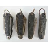 Four Royal Navy issue folding pocket knives, having military marks upon.