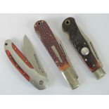 A quantity of cowboy themed western folding pocket knives including;