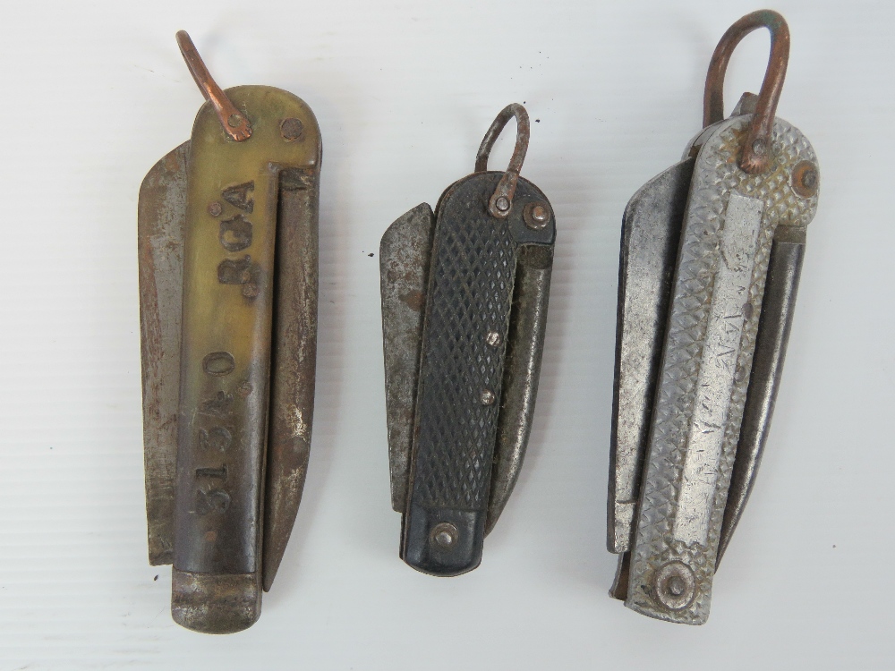 Three WWI Royal Naval issue pocket knives, Sheffield made, one having horn grips.