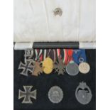 A WWII German Panzer Officers medal group including three WWI medals and Iron Crosses,
