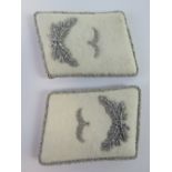 A pair of WWII German Luftwaffe Officers collar boards with silver brocade.