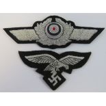 A WWII German Luftwaffe Officers silver brocade peaked cap badge with silver brocade cap Eagle.
