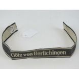 A Waffen SS tunic cuff title 'Gotz Von Berlichengen', Bevo makers details upon.