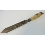 A 19th century Swiss souvenir letter opener having tooled and inlaid horn blade inscribed Montreux,