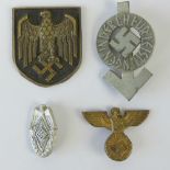 Four WWII German badges including; a Hitler youth and Wehrmach and a pith helmet decal.
