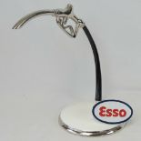 A contemporary desk piece in the form of a Esso petrol dispenser. Cast metal and chromed handle.