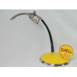 A contemporary desk piece in the form of a Shell petrol dispenser. Cast metal and chromed handle.