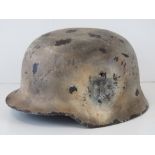 A fine replica WWII German helmet with W