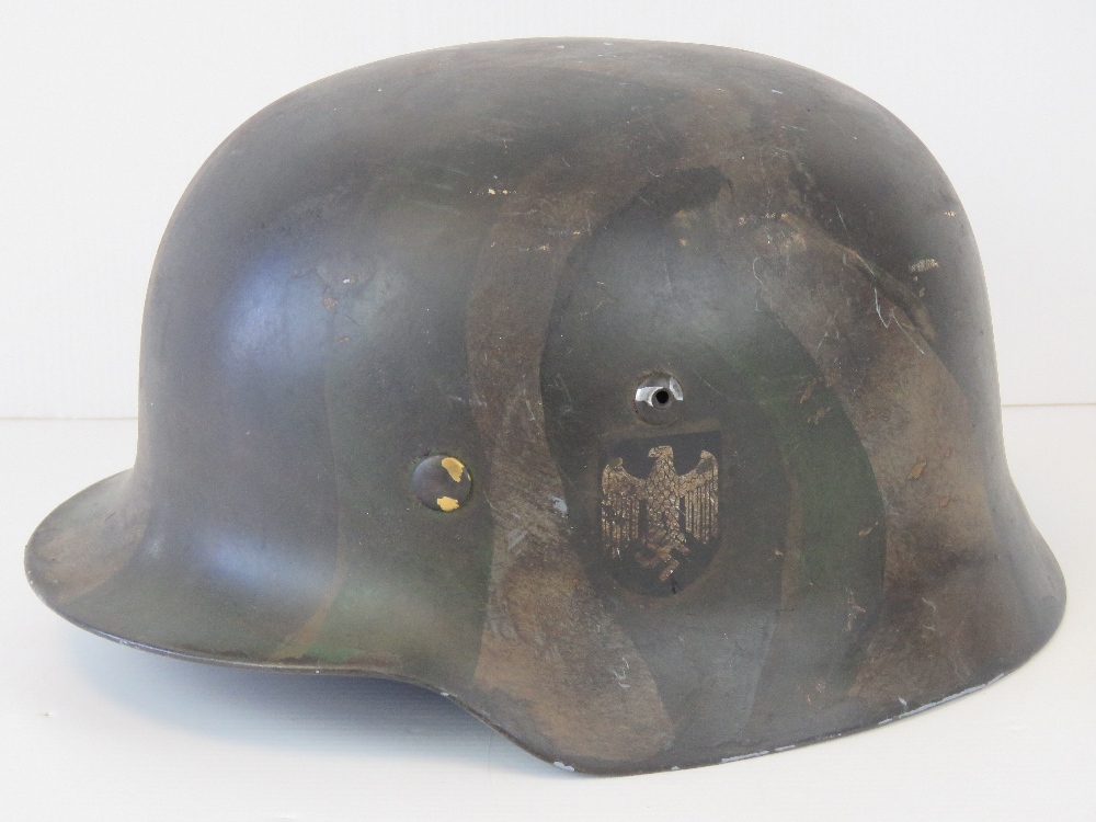 A fine replica WWII German helmet with W