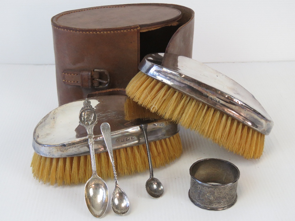 A pair of HM silver brushes complete with pigskin leather case, hallmarked Birmingham 1923.