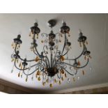 A good contemporary steel and glass Classically shaped chandelier having fifteen single bulb