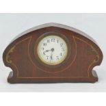 A small Swiss made mantle clock in the Art Nouveau style, mahogany frame and handpainted 'inlay',