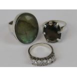 Three silver rings; abalone shell size O, smoky quartz size O, and a five stone ring size K-L.