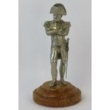 A 20th century cold cast figurine of Napoleon Bonaparte, 15cm high raised over circular plinth.