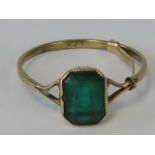 A 9ct gold ring having octagonal faceted green paste,