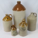 A Doulton Lambeth four gallon stoneware flagon, 52cm high, and four other vintage stoneware flagons,