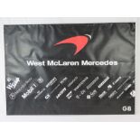 A large black ground advertising poster for West Maclaren Mercedes, measuring 90 x 127cm,