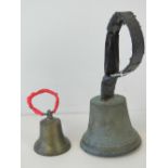 Two gun metal hand bells, the larger marked B 28 in relief and both with replacement handles,