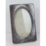 A vintage HM silver photograph frame having engine turned pattern to front, 16 x 10.