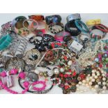 A large quantity of assorted modern and vintage costume jewellery including; shell bracelet,