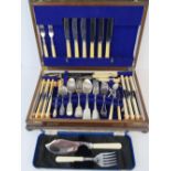 A part canteen of cutlery, carvers and an assortment of associated items,