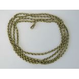 A gilt metal guard chain complete with dog clasp, chain measuring 136cm.