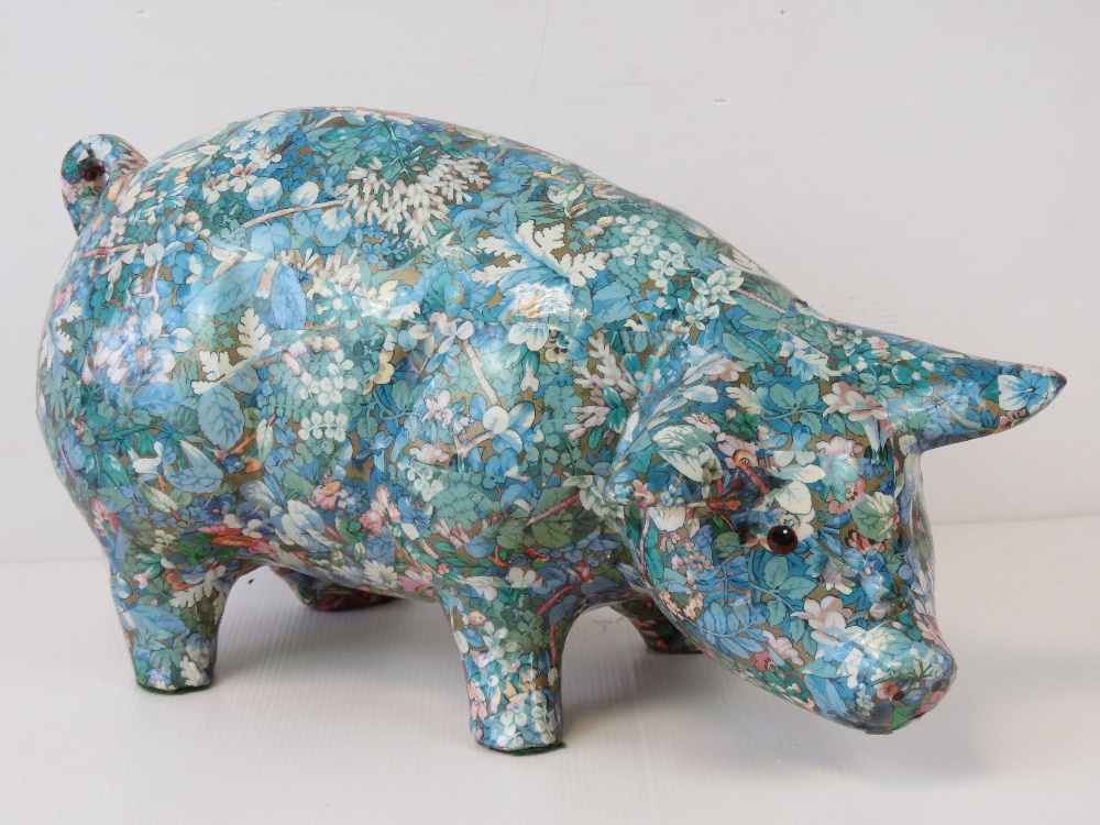 A contemporary floral 'chintz' design ceramic pig, 40cm in length.