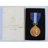 A commemorative Royal Mint 'Queens Golden Jubilee Medal' complete with ribbon, box and certificate.