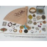 A quantity of assorted costume jewellery and coins including a vintage glass bead necklace,