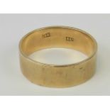 A 9ct gold wide band, stamped 9ct, size U, 5g.